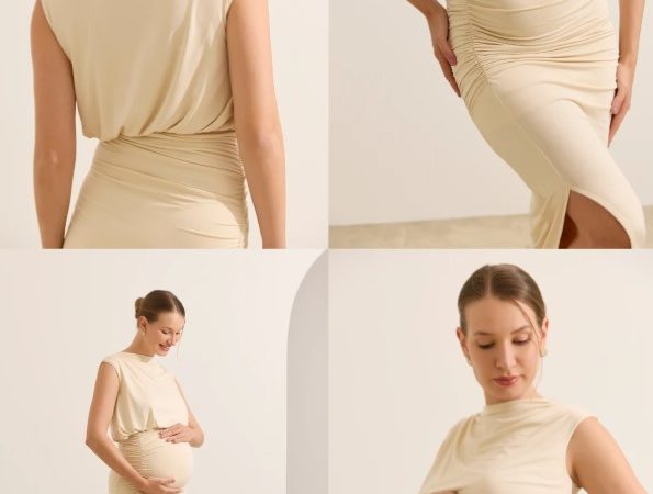Mulher usando look gestante para trabalho com blazer estruturado e vestido social, em ambiente corporativo, transmitindo elegância e conforto