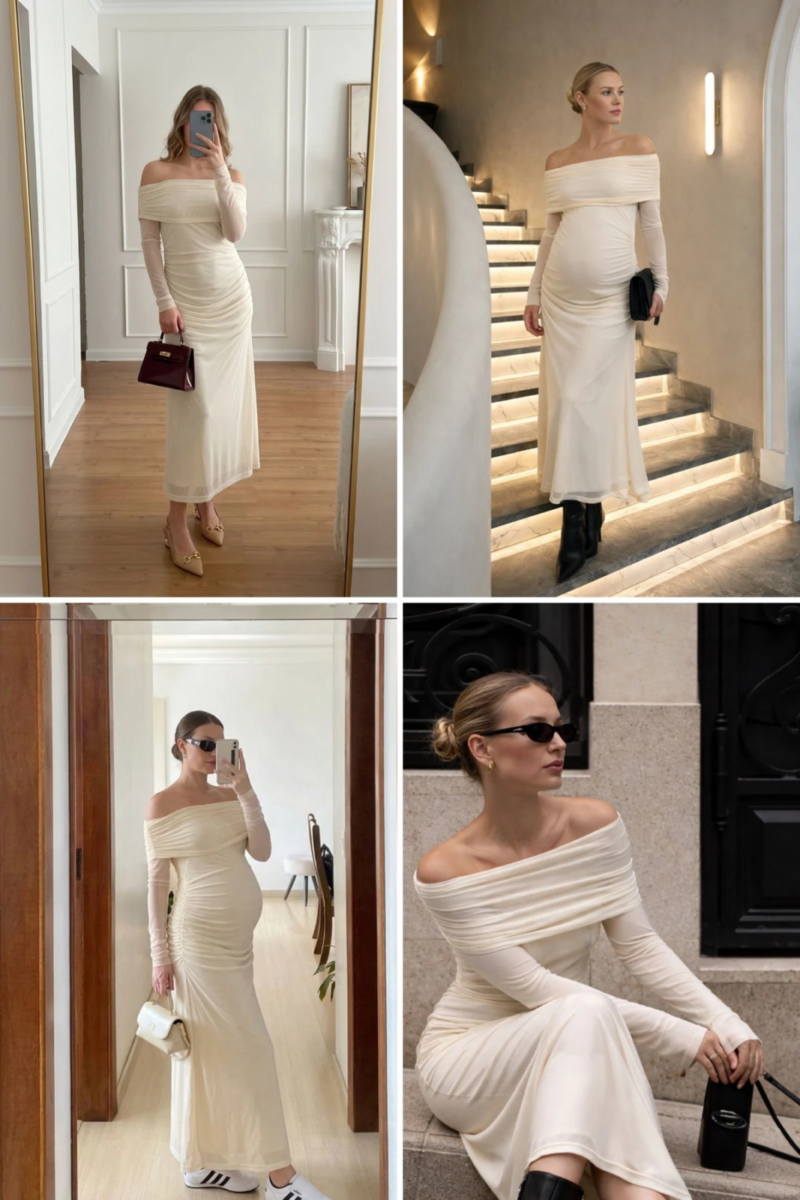 Gestante usando vestido longo pérola ombro a ombro com mangas longas e drapeado, em composição com bolsa e botas pretas.