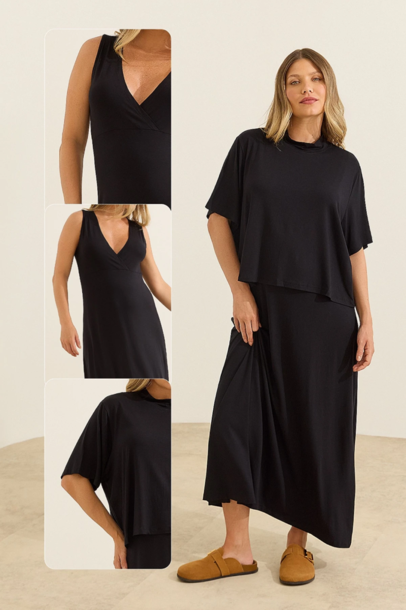 Gestante usando conjunto preto 2 em 1 que parece vestido midi com cropped para amamentação e saia com fenda lateral.
