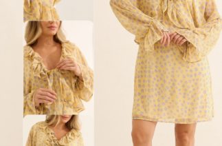 Gestante usando vestidinho curto floral amarelo com babados e decote ajustável para gestação e amamentação.