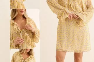 Gestante usando vestidinho curto floral amarelo com babados e decote ajustável para gestação e amamentação.
